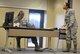 Airman Carroll portraying a sexual assault victim, tries to get the attention of Tech. Sgt. Nelson who is portraying her supervisor Aug.30, 2017 on Ellsworth Air Force Base