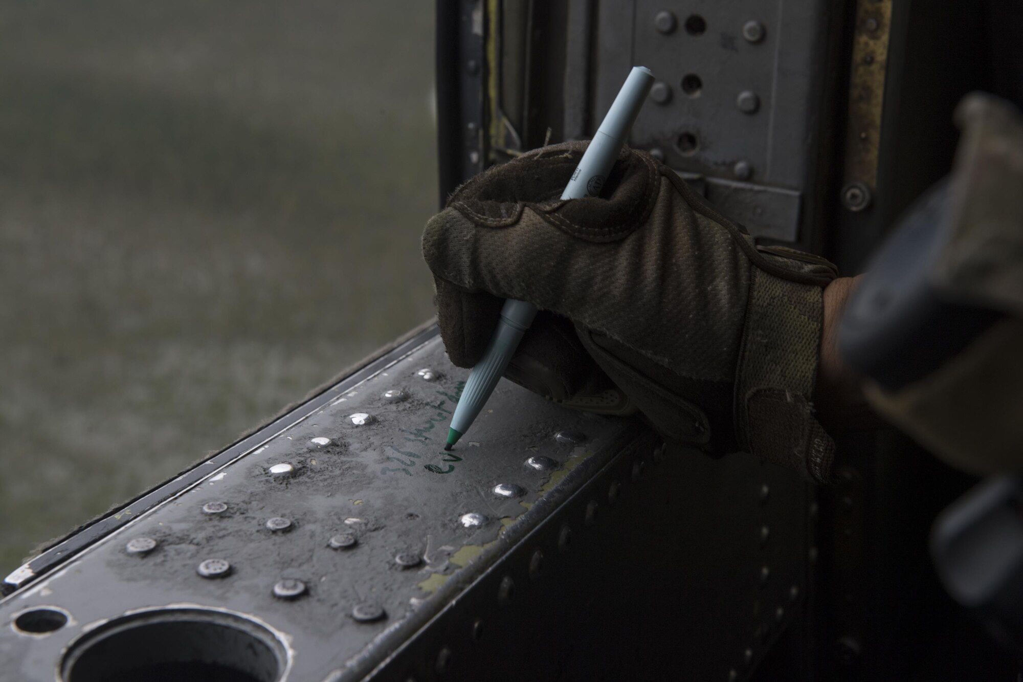 A special missions aviator from the 41st Rescue Squadron, writes down an address during  pre-flight checks, Aug. 30, 2017, at Easterwood Airport in College Station, Texas.