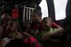 A family of evacuees wait for the rest of their family members onboard an HH-60G Pave Hawk, assigned to the 41st Rescue Squadron, Aug. 30, 2017, over a residence in the Houston, Texas area. The 347th Rescue Group from Moody Air Force Base, Ga. responded with its rescue aircraft and personnel in support of FEMA after Hurricane Harvey brought flooding and destruction to parts of Texas. (U.S. Air Force photo by Tech. Sgt. Zachary Wolf)