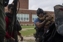 Pararescuemen from the 38th Rescue Squadron unload evacuees from an HH-60G Pave Hawk, Aug. 30, 2017, in the Houston, Texas area.