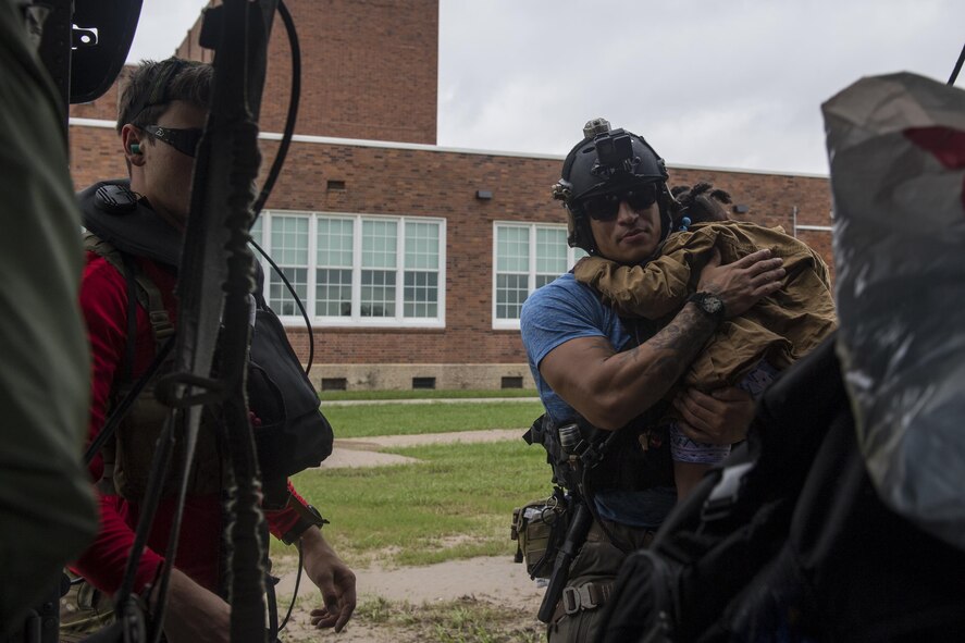 Pararescuemen from the 38th Rescue Squadron unload evacuees from an HH-60G Pave Hawk, Aug. 30, 2017, in the Houston, Texas area.