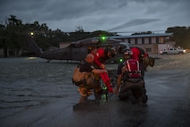 Pararescuemen from the 38th Rescue Squadron and local rescue assets, set up a basket to carry an evacuee, Aug. 30, 2017, in the Houston, Texas area.