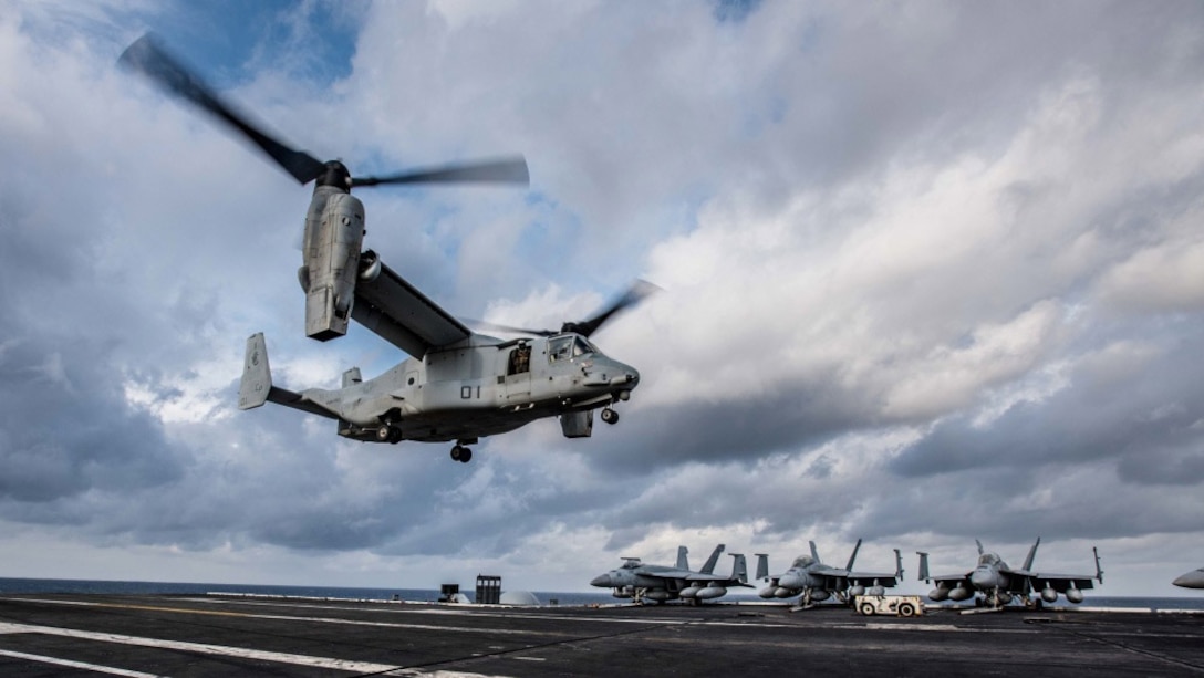 An MV-22 Osprey of Marine Medium Tiltrotor Squadron 265 lands on the flight deck of the Navy’s forward-deployed aircraft carrier, USS Ronald Reagan.