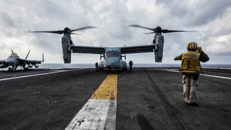 An MV-22 Osprey of Marine Medium Tiltrotor Squadron 265 lands on the flight deck of the Navy’s forward-deployed aircraft carrier, USS Ronald Reagan.