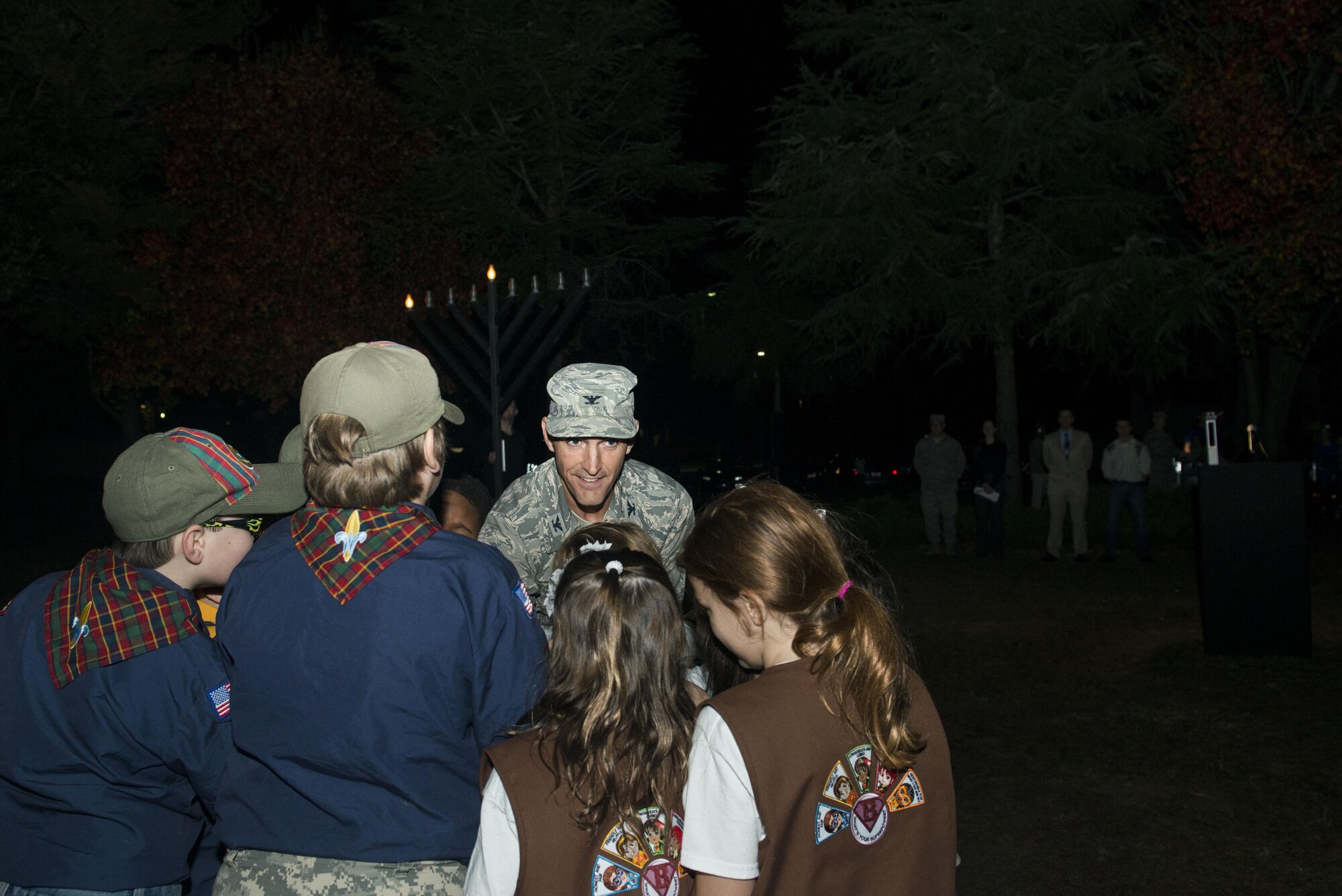 U.S. Air Force Col. Daniel Lasica, 20th Fighter Wing commander, flips a switch with members of Cub Scout Troop 320 and Girl Scout Troop 1829 during a Holiday Display Lighting event in front of the Friendship Chapel at Shaw Air Force Base, South Carolina, Nov. 29, 2017.