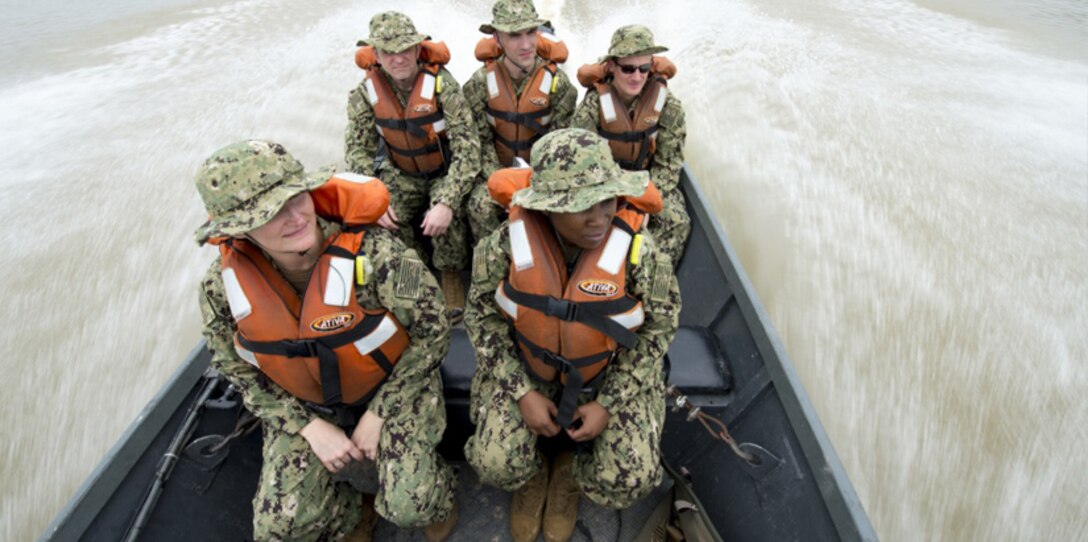 A team of five U.S. Navy doctors travel by boat to a remote village along the Amazon River in Brazil.