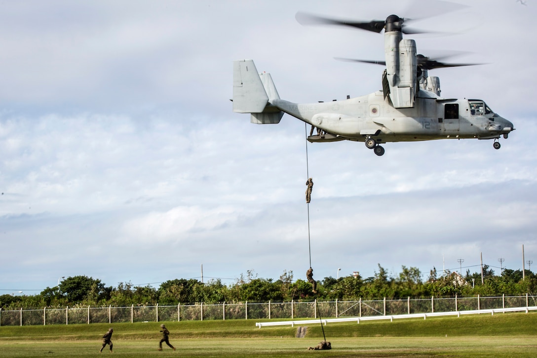 Marines participate in fast-rope training from a MV-22B Osprey.