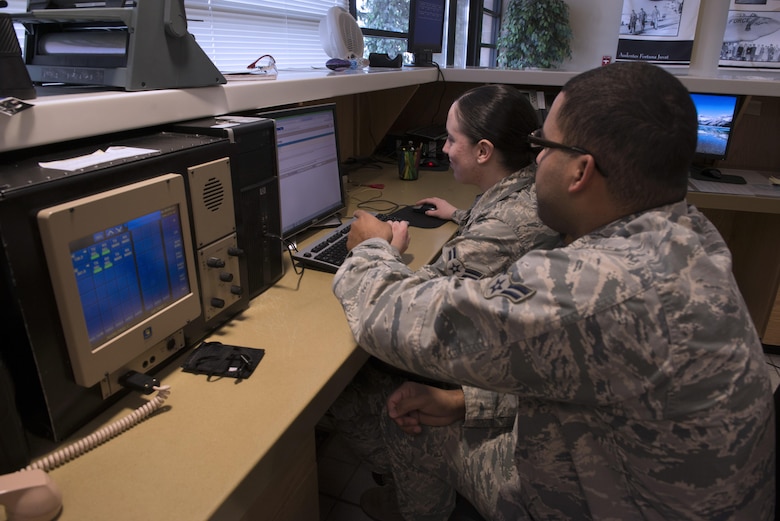 From Left to Right, Airman 1st Class Douglas Whitter and Sabrina Watson, 366th Operations Support Squadron airfield management coordinators, fill out flight plans for pilots at Mountain Home Air Force Base, Idaho, on Nov. 29, 2017. The airfield management team has to complete and submit their flight plans for approval prior to pilots taking off. (U.S. Air Force photo by Senior Airman Lauren-Taylor Levin)