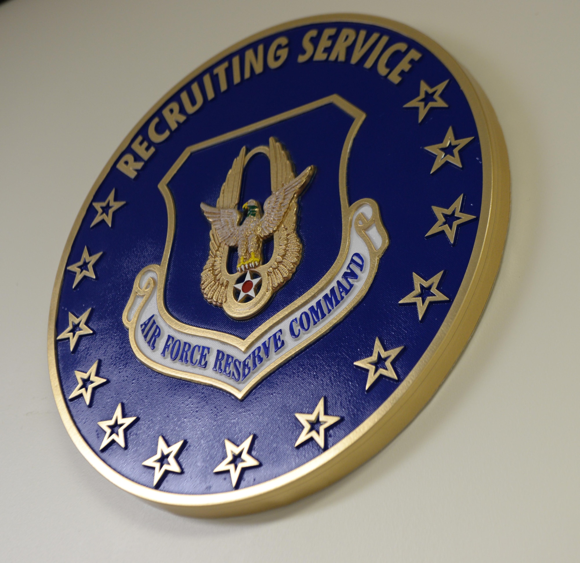 The logo for the U.S. Air Force Reserves command sits in the office of U.S. Air Force Master Sgt. Brandy Venson, an in-service recruiter assigned to the 97th Air Mobility Wing, November 20, 2017, Altus Air Force base, Okla.