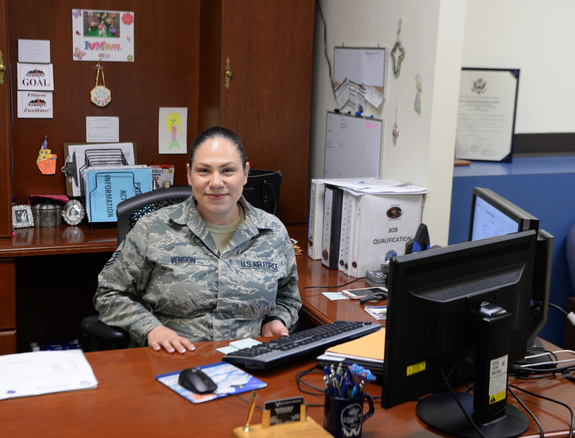 U.S. Air Master Sgt. Brandy Venson, an in-service reserves recruiter assigned to the 97th Air Mobility Wing, sits behind her desk, November 20, 2017, Altus Air Force base, Okla