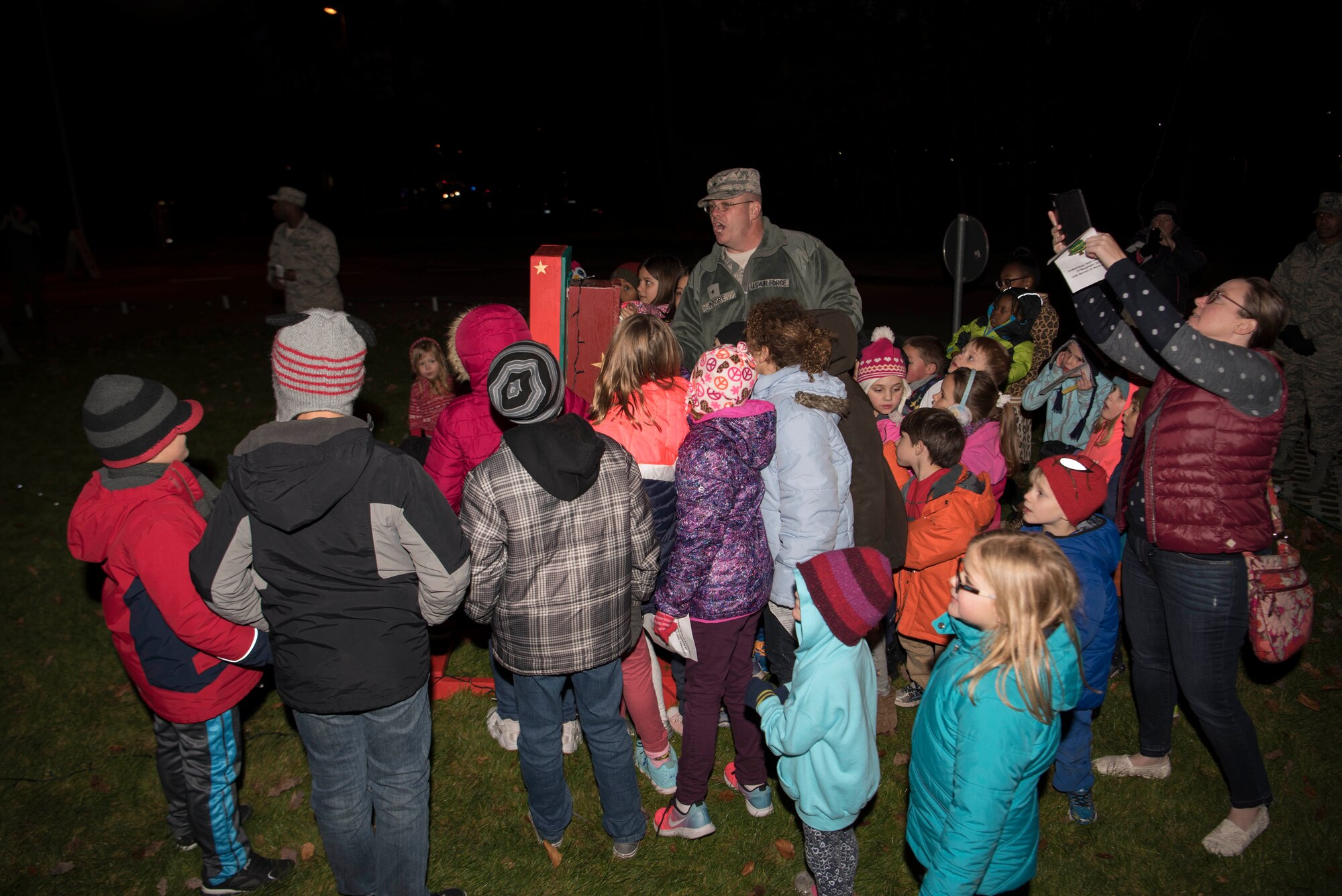 U.S. Air Force Brig. Gen. Richard Moore, 86th Airlift Wing commander, prepares to turn on the base Christmas tree lights with children of the Kaiserslautern Military Community at Ramstein Air Base, Germany, Nov. 29, 2017. The Christmas tree was donated by the village of Ramstein-Miesenbach in 2010. (U.S. Air Force photo by Airman 1st Class Devin M. Rumbaugh)