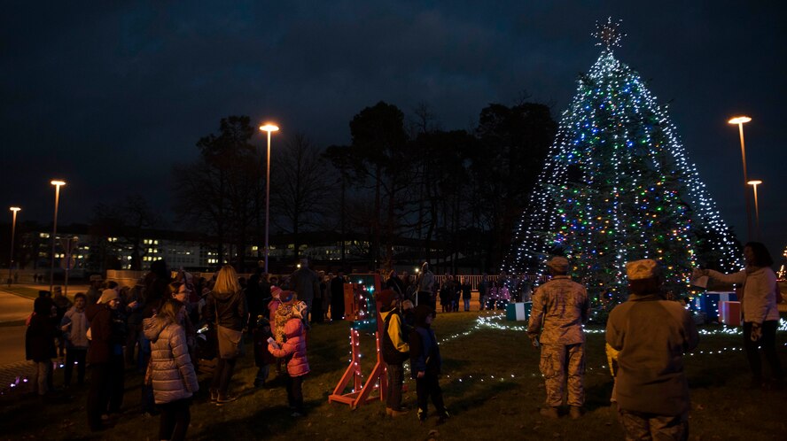 Members of the Kaiserslautern Military Community and Ramstein-Miesenbach gather for the lighting of the base Christmas tree at Ramstein Air Base, Germany, Nov. 29, 2017. The tree represents the ever growing relationship between the KMC and the local Ramstein-Miesenbach community. (U.S. Air Force photo by Airman 1st Class Devin M. Rumbaugh)