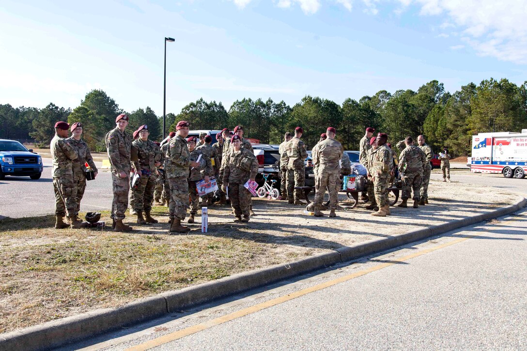 Soldiers wait to donate toys for the 20th Annual Randy Oler Memorial Operation Toy Drop at Fort Bragg, N.C.