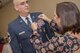 Beth Houtz places a retirement pin on her husband, Chief Master Sgt. David Houtz, 823d Base Defense Squadron chief enlisted manager’s lapel, during his retirement ceremony, Dec. 1, 2017, at Moody Air Force Base, Ga. Houtz enlisted in the Air Force on Oct. 6, 1991. During his 27-year career, he has held numerous leadership roles while supporting Operations Provide Promise, Southern Watch, Enduring Freedom, Iraqi Freedom and Inherent Resolve. (U.S. Air Force photo by Senior Airman Daniel Snider)