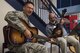Master Sgt. Jeffrey Whitaker, 23d Wing Staff Agencies first sergeant, left, and Derrick Harris, 23d Force Support Squadron casualty assistance representative, pose for a photo during the Airmen and Family Readiness Center’s (AFRC) ‘grand reopening’, Nov. 29, 2017, at Moody Air Force Base, Ga. The AFRC relocated to the Freedom 1 Fitness Center, but held the event as the grand finale to their month of the military family campaign and to showcase their new location to Moody. (U.S. Air Force photo by Senior Airman Janiqua P. Robinson)