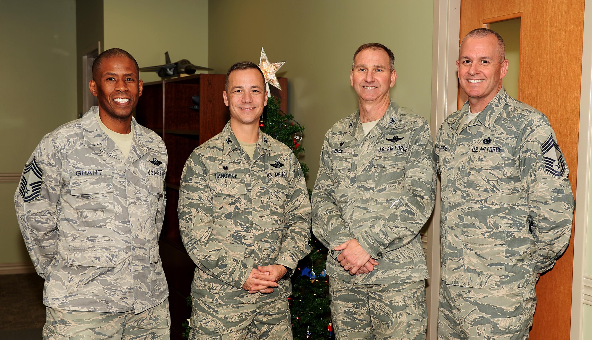 Col. James P. Ryan, the 157th Air Refueling Wing commander, and Col. Robert L. Hanovich, 22nd Operations Group commander, assigned to the 22nd Air Refueling Wing, McConnell Air Force Base, Kan., Chief Master Sgt. Gary A. Cabral, 64th Air Refueling Squadron chief enlisted manager, and Chief Master Sgt. Derrick W. Grant, the 22nd OG boom operator functional manager, pose for a group photo on November 29, 2017, at Pease Air National Guard Base, N.H. The senior leaders met to reinforce the bond between the two Wings as they prepare for the scheduled conversion to the KC-46A Pegasus. (N.H. National Guard photo by Staff Sgt. Kayla Rorick)