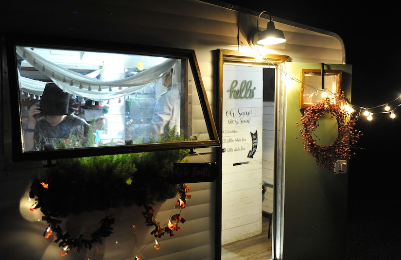 Event attendees take holiday photos inside a photo booth at Joint Base Charleston – Weapons Station, S.C., Nov. 30, 2017.