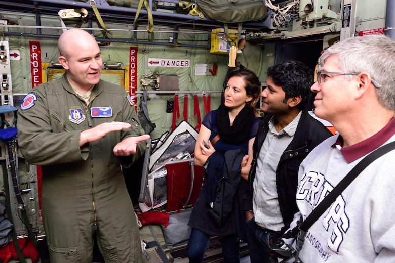 Maj. Ryan Rickert, 53rd Weather Reconnaissance Squadron aerial reconnaissance weather officer, relates how the 53rd WRS “Hurricane Hunters” gather weather data to students and researchers from the Scripps Institute of Oceanography Nov. 29, 2017, at Brown Field Airport, San Diego, California. Hurricane Hunters met with Scripps scientists that day to discuss plans for participating in atmospheric river reconnaissance missions in early 2018. (U.S. Air Force photo by Tech. Sgt. Ryan Labadens)