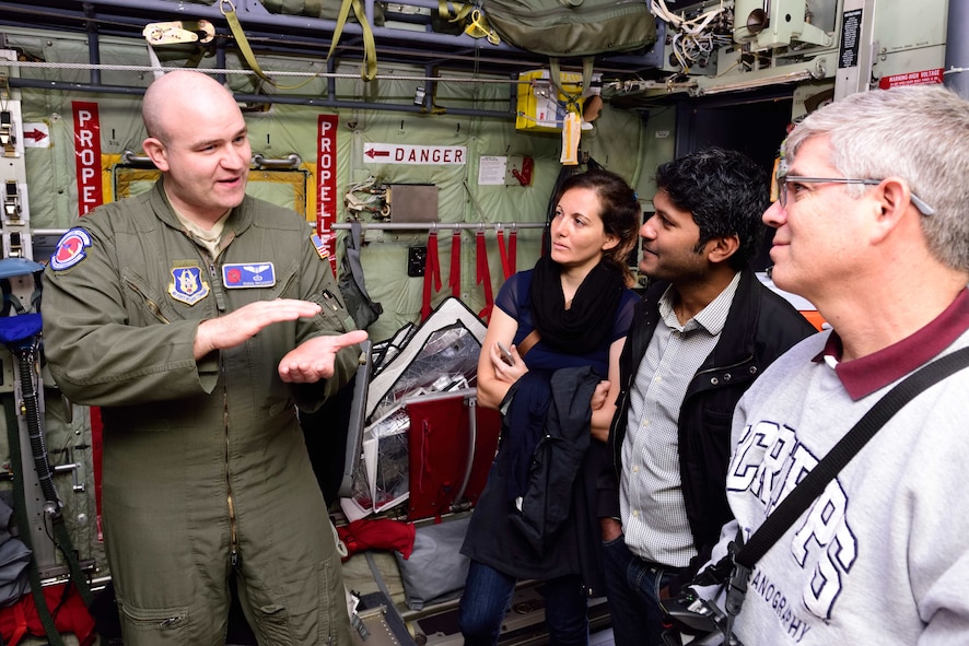 Maj. Ryan Rickert, 53rd Weather Reconnaissance Squadron aerial reconnaissance weather officer, relates how the 53rd WRS “Hurricane Hunters” gather weather data to students and researchers from the Scripps Institute of Oceanography Nov. 29, 2017, at Brown Field Airport, San Diego, California. Hurricane Hunters met with Scripps scientists that day to discuss plans for participating in atmospheric river reconnaissance missions in early 2018. (U.S. Air Force photo by Tech. Sgt. Ryan Labadens)