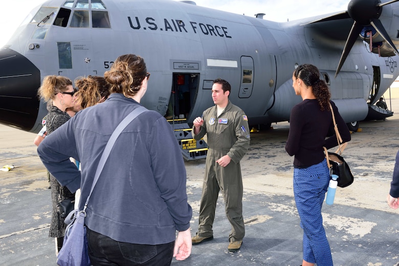 Maj. John Gharbi, 53rd Weather Reconnaissance Squadron navigator, explains the mission of the 53rd WRS “Hurricane Hunters” to students and researchers from the Scripps Institute of Oceanography Nov. 29, 2017, at Brown Field Airport, San Diego, California. Hurricane Hunters met with Scripps scientists that day to discuss plans for participating in atmospheric river reconnaissance missions in early 2018. (U.S. Air Force photo by Tech. Sgt. Ryan Labadens)