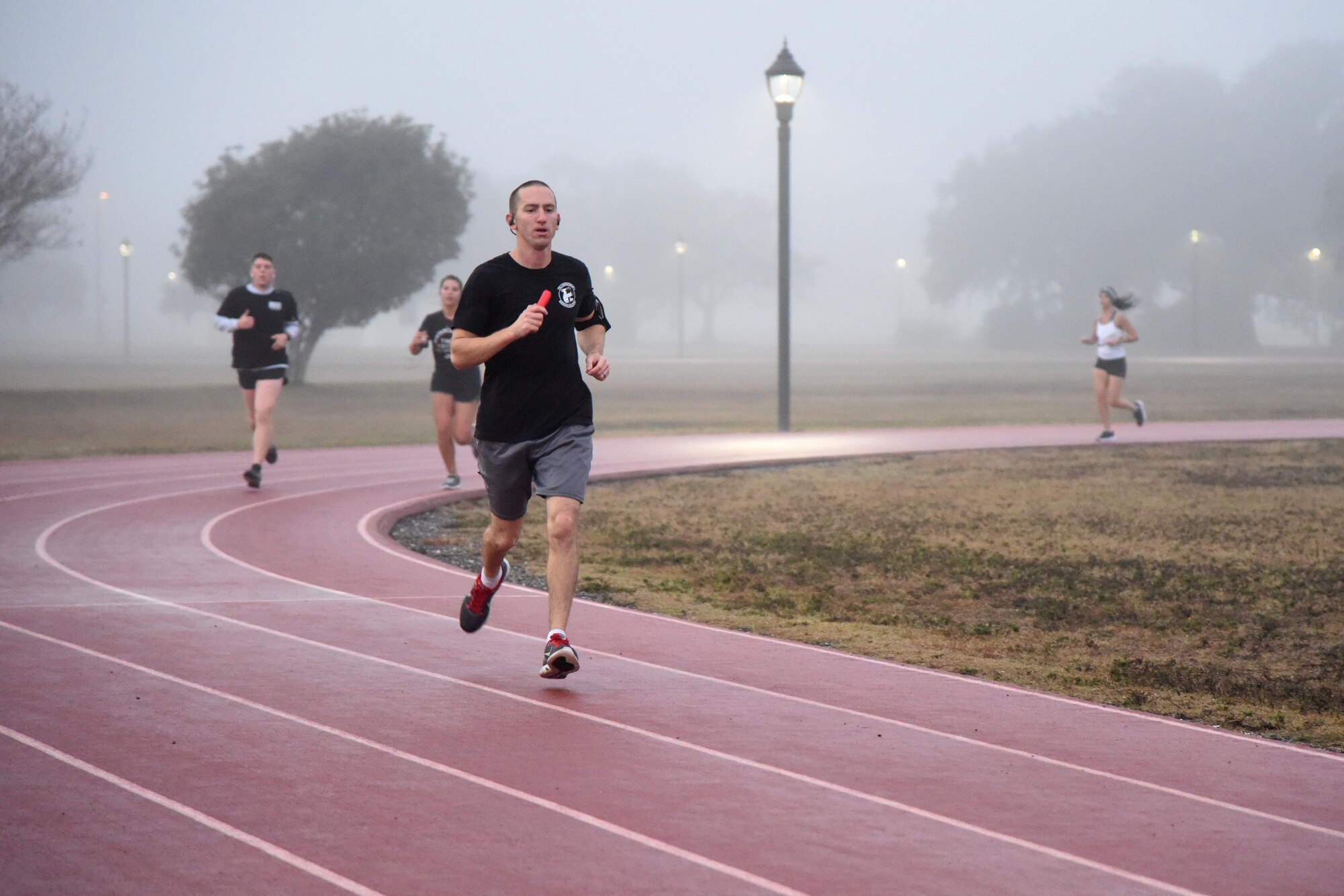 Keesler personnel participate in the 8th annual Dragon Challenge at the triangle track Dec. 1, 2017, on Keesler Air Force Base, Mississippi. The base-wide event was held to bring together Airmen to promote physical training throughout the holidays. (U.S. Air Force photo by Kemberly Groue)