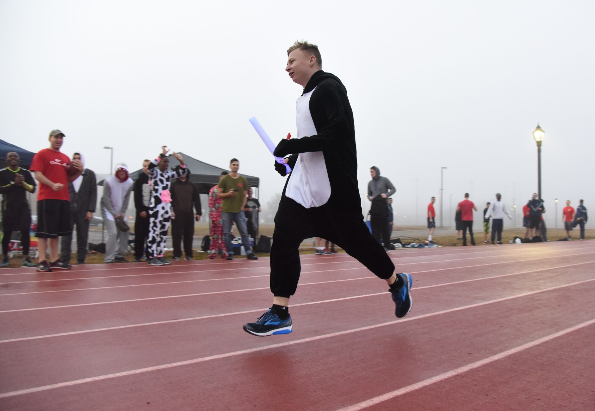 Senior Airman Cody Stoll, 81st Communications Squadron client systems supervisor, participates in the 8th annual Dragon Challenge at the triangle track Dec. 1, 2017, on Keesler Air Force Base, Mississippi. The base-wide event was held to bring together Airmen to promote physical training throughout the holidays. (U.S. Air Force photo by Kemberly Groue)