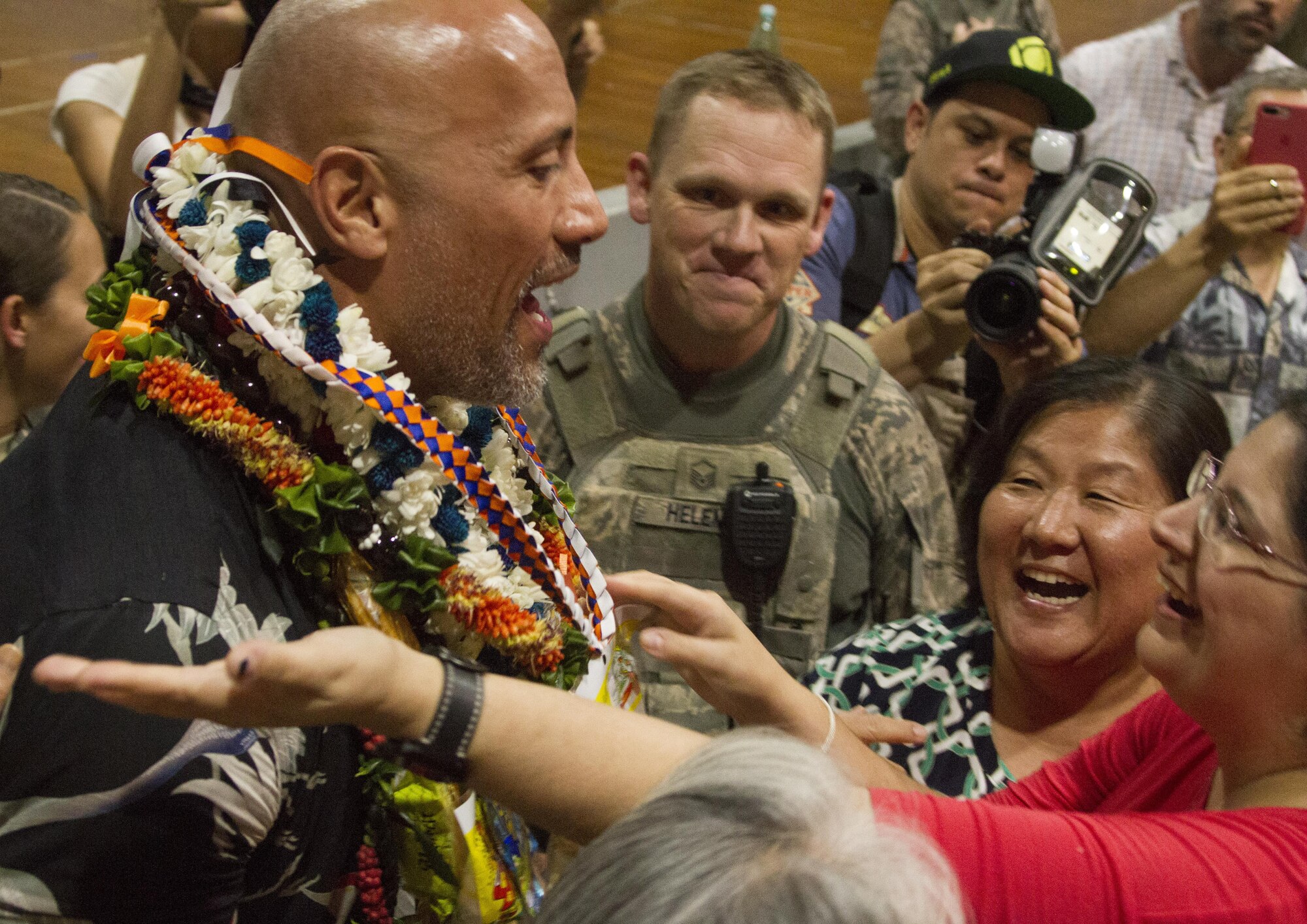 Dwayne Johnson, star of “Jumanji: Welcome to the Jungle,” receives leis during his visit to Hickam Memorial Theater for an advance screening of the movie, at Joint Base Pearl Harbor-Hickam, Hawaii, Nov. 29, 2017.  Army & Air Force Exchange Service hosted the event, in partnership with Sony Pictures and the USO, as a thank you to service members and their families. (Sony Pictures courtesy photo)