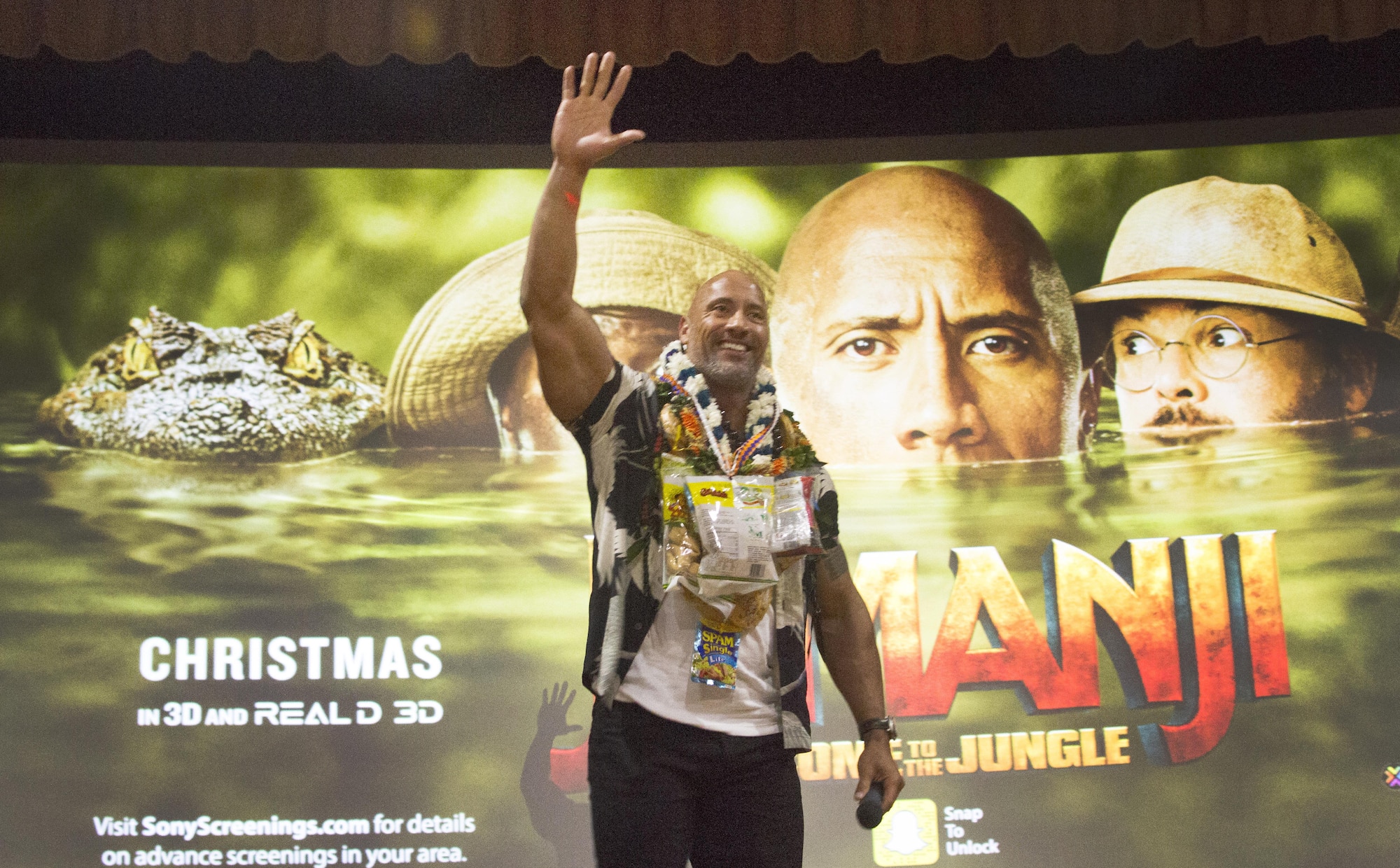 Dwayne Johnson, star of “Jumanji: Welcome to the Jungle,” waves to his fans during his visit to Hickam Memorial Theater for an advance screening of the movie, on Joint Base Pearl Harbor-Hickam, Hawaii, Nov. 29, 2017.  Army & Air Force Exchange Service hosted the event, in partnership with Sony Pictures and the USO, as a thank you to service members and their families. (Sony Pictures courtesy photo)