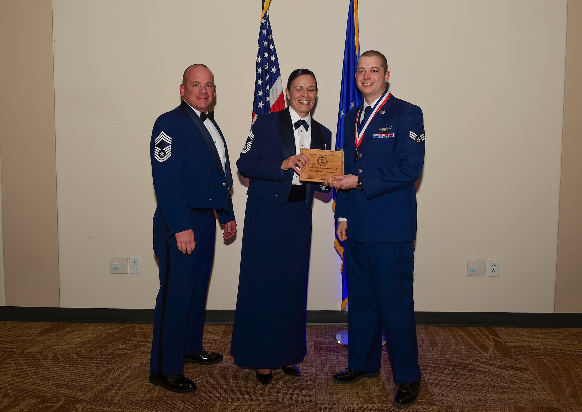 Senior Airman Nikolaus Clausen, 2nd Space Warning Squadron ground system operator, receives the Academic Achievement Award during the Airmen Leadership School Class 18-A graduation Nov. 29, 2017, on Buckley Air Force Base, Colorado.