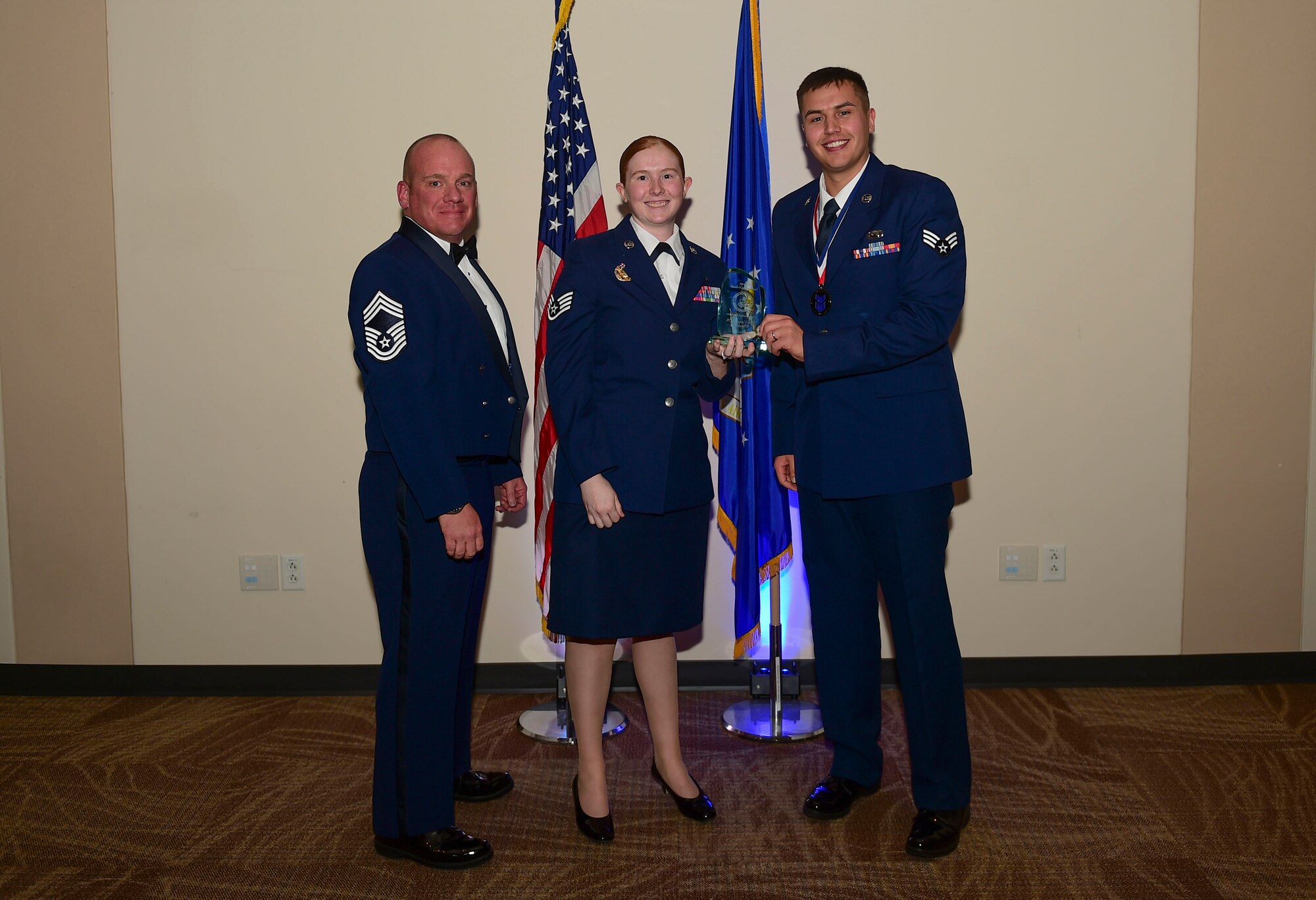 Senior Airman Cameron Wheelehan, 566th Intelligence Squadron signals analyst, receives the Distinguished Graduate Award during the Airmen Leadership School Class 18-A graduation Nov. 29, 2017, on Buckley Air Force Base, Colorado.