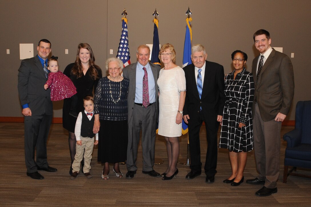 Kenneth Callicutt (center), U.S. Strategic Command (USSTRATCOM) director of capability and resource integration, takes a photo with his family before his retirement ceremony at Offutt Air Force Base, Neb., Dec. 1, 2017. During his 12 years with USSTRATCOM, Callicutt led the team responsible for conducting force management and analysis to include integrating, and advocating future concepts, weapons system development, support for emerging technologies, and command and control architecture. One of nine Department of Defense unified combatant commands, USSTRATCOM has global responsibilities assigned through the Unified Command Plan that include strategic deterrence, nuclear operations, space operations, joint electromagnetic spectrum operations, global strike, missile defense, and analysis and targeting.