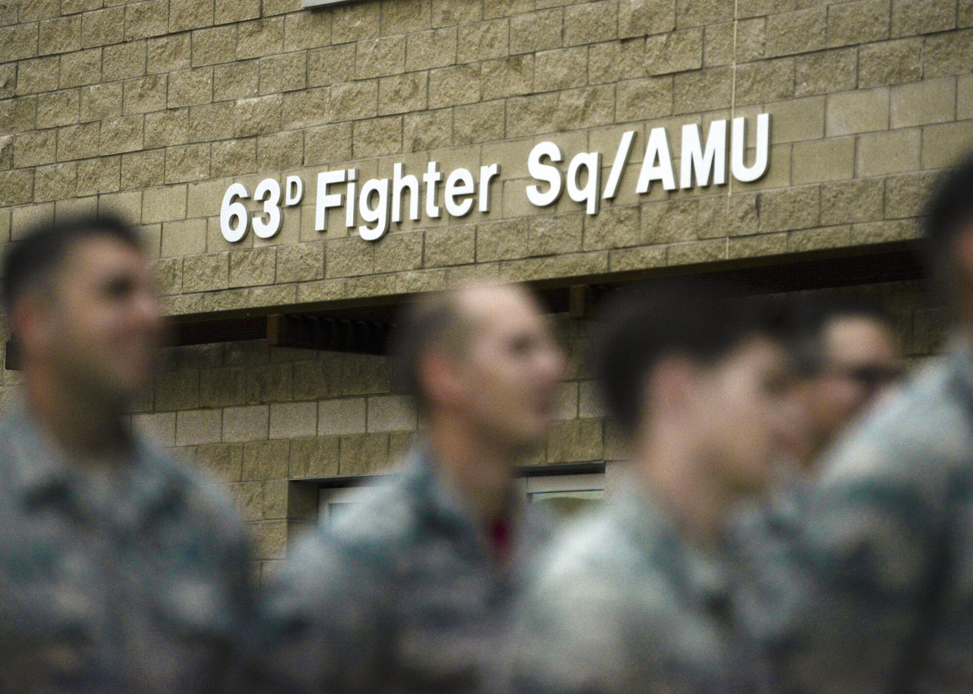 Airmen assigned the 63rd Aircraft Maintenance Unit stand in formation for roll call at Luke Air Force Base, Ariz., Dec. 1, 2017. 146 personnel and seven aircraft are currently assigned to the 63rd. (U.S. Air Force photo/Airman 1st Class Caleb Worpel)