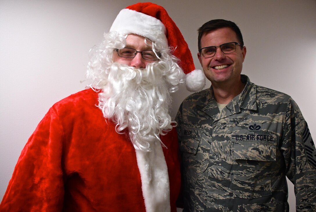 A special "jolly" guest popped up at the 932nd Airlift Wing late in the afternoon, with the sound of bells ringing on the first day of December, 2017.  Santa Claus stopped by on Friday to make the rounds and talk with the highest ranking "kid" at the Illinois unit, 932nd Command Chief Master Sgt. Chad Welch.  Chief Welch and Santa are planning a big day for all the Air Force Reserve Citizen Airmen deployers and their families on Saturday, Dec. 2, from 10 a.m. until noon in the hangar at Scott Air Force Base, Ill.  There will be free food, games, a marching band, and holiday fun for the entire family. Santa Claus will visit the hangar at some surprise moment, so reservist's children can share their Christmas wish list with him potentially.  Special booths will provide resources covering Tricare, VA, Key Spouse and Yellow Ribbon information.  (U.S. Air Force photo by Lt. Col. Stan Paregien)