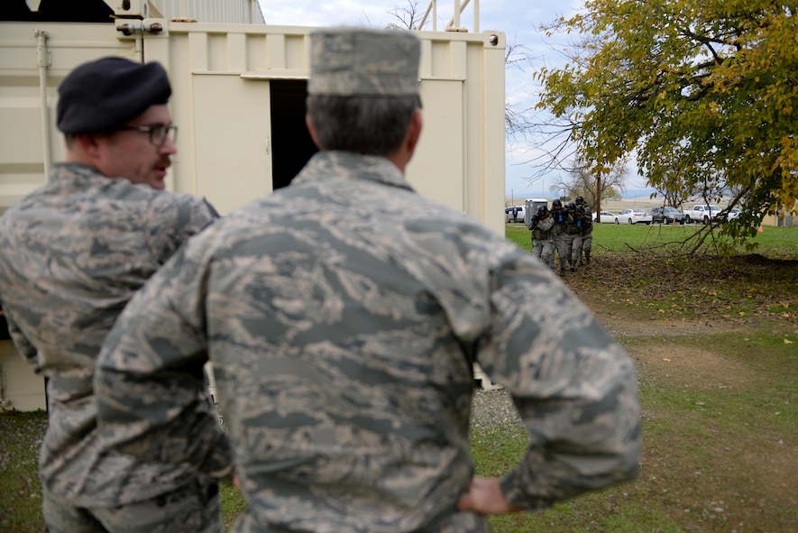 Tech. Sgt. Nicholas Weiss (left), 9th Security Forces Squadron member, explains a demonstration at a newly constructed training area to Gen. David L. Goldfein, Chief of Staff of the Air Force, Nov. 30, 2017, at Beale Air Force Base, California. The training area was designed to incorporate more training scenarios to prepare defenders for deployment and increase readiness.(U.S. Air Force photo/ Senior Airman Ramon A. Adelan)