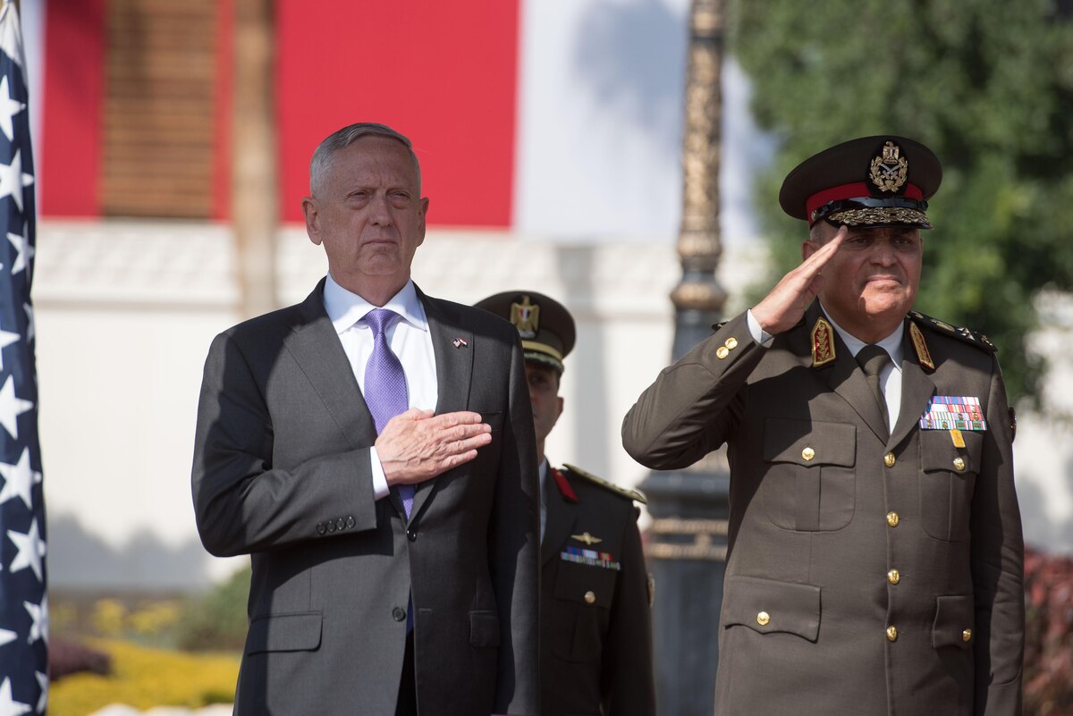 Defense Secretary James N. Mattis and the Egyptian defense minister stand at attention.