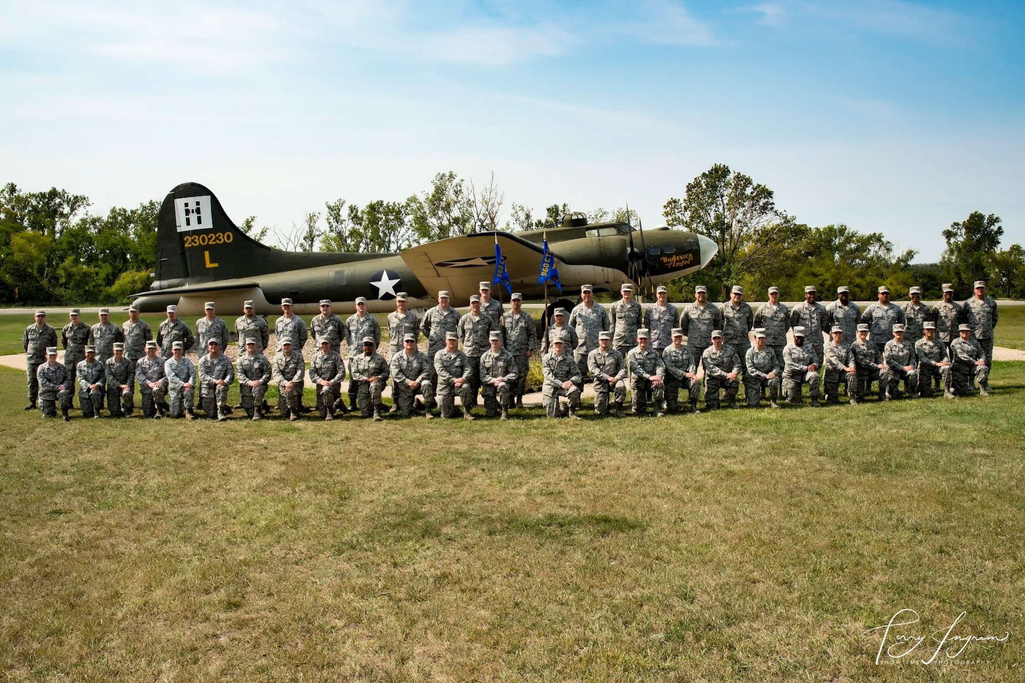 Members of the 860th and 960th Network Warfare Flights pose for a photo Sept. 7 in front of a B-17 Flying Fortress at Offutt Air Force Base, Neb.
