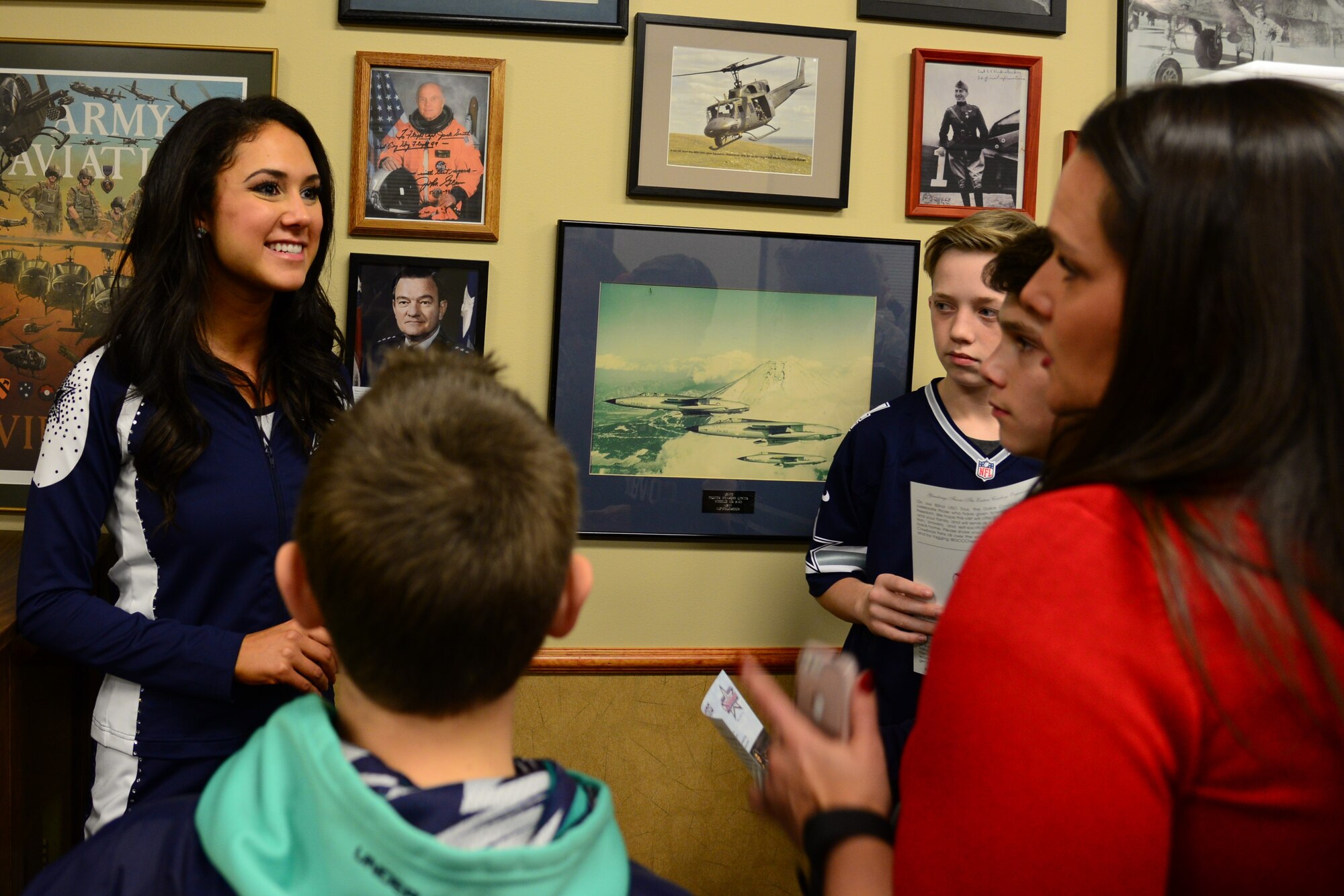 Dallas Cowboys Cheerleader Tess Guidry, speaks to families during a meet and greet Dec. 1, 2017, at Malmstrom Air Force Base, Mont.