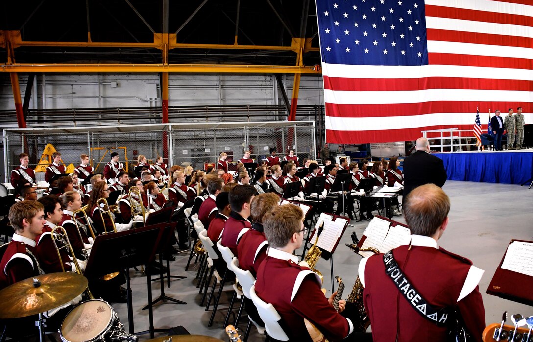 The 932nd Airlift Wing said farewell today to a large group of Air Force Reserve Command deployers from the Illinois unit, who will be heading out shortly to parts unknown to serve the nation. Thanks and congratulations to everyone who worked behind the scenes, including our legal and finance teams, along with the American Red Cross, the VA, USO, wing leadership, the chaplains, key spouses, yellow ribbon, and Airmen and family readiness personnel. Ceremony music was provided by the Belleville West High School marching band seen here waiting to play the American National Anthem before 932nd AW and base leadership in attendance.  Standing on stage from left to right are Congressman Mike Bost, Col. Ray Smith, the commander of the reserve wing, and Command Chief Master Sgt. Chad Welch.  (U.S. Air Force photo by Lt. Col. Stan Paregien)#932ndAirliftWing, #932ndAW, #AFReserve #932AW #932ndAirliftWing #patriotism #CitizenAirmen #picoftheday #veterans #oldglory #usaflag #starsandstripes #airmen #USA #932ndAW, 932AW, 932nd Airlift Wing, 932nd AW, 932nd Citizen Airman, Cantwell, Deployers, Santa