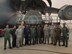 Propulsion specialists, Tech. Sgt. Jarrod Plotner and staff Sgt. Ben Wibmerly, third and fourth from right, pose for a photo with engine maintainers for the Indian Air Force, beside a C-17 Globmaster, a recent addition to the IAF. Plotner and Wimberly helped train their Indian counterparts on C-17 engine maintenance procedures in October and November.