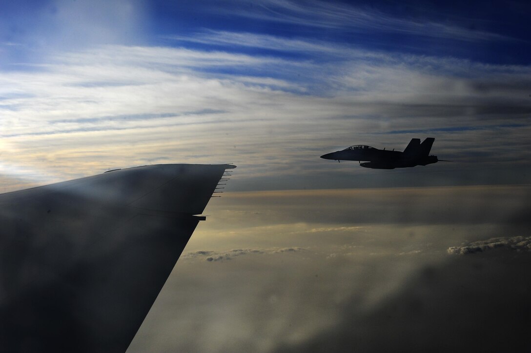 An EA-18G Growler waits to be fueled by a KC-10 Extender over Syria, Oct. 27, 2017. The Growler provides tactical jamming and electronic protection to U.S. military forces and allies around the world. (U.S. Air Force photo by Tech. Sgt. Anthony Nelson Jr.)