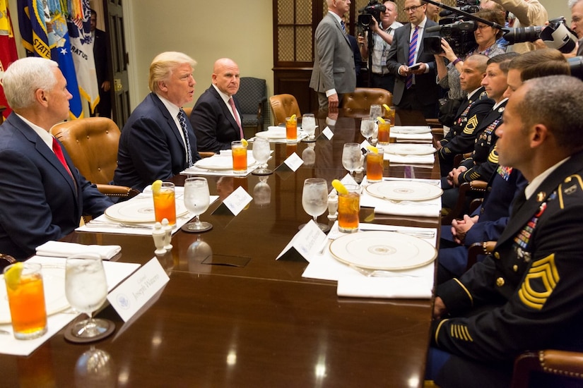 From left, Vice President Mike Pence, President Donald J. Trump, and National Security Advisor Army Lt. Gen. H.R. McMaster talk with service members