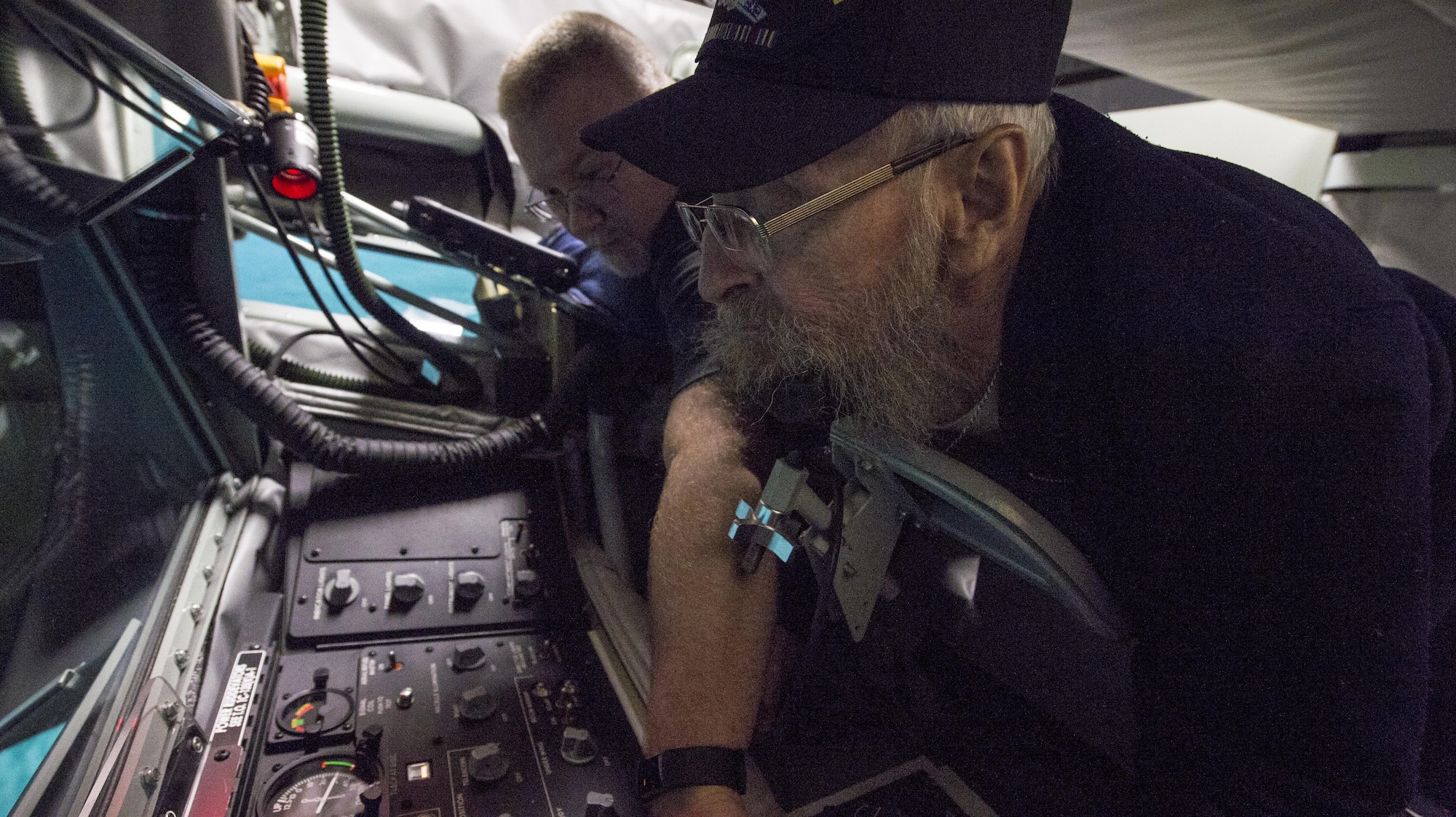 Mike Conners, Grissom’s civilian BOWST trainer, coaches Robert Tobey during a simulated refueling mission at Grissom Air Reserve Base, Ind., Oct. 27, 2017. 94-year-old Tobey piloted a B-17 Flying Fortress over Europe during World War II with the United States Army Air Corps. (U.S. Air Force photo / Senior Airman Harrison Withrow)