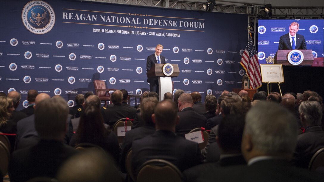 Deputy Defense Secretary Patrick M. Shanahan speaks on a stage.