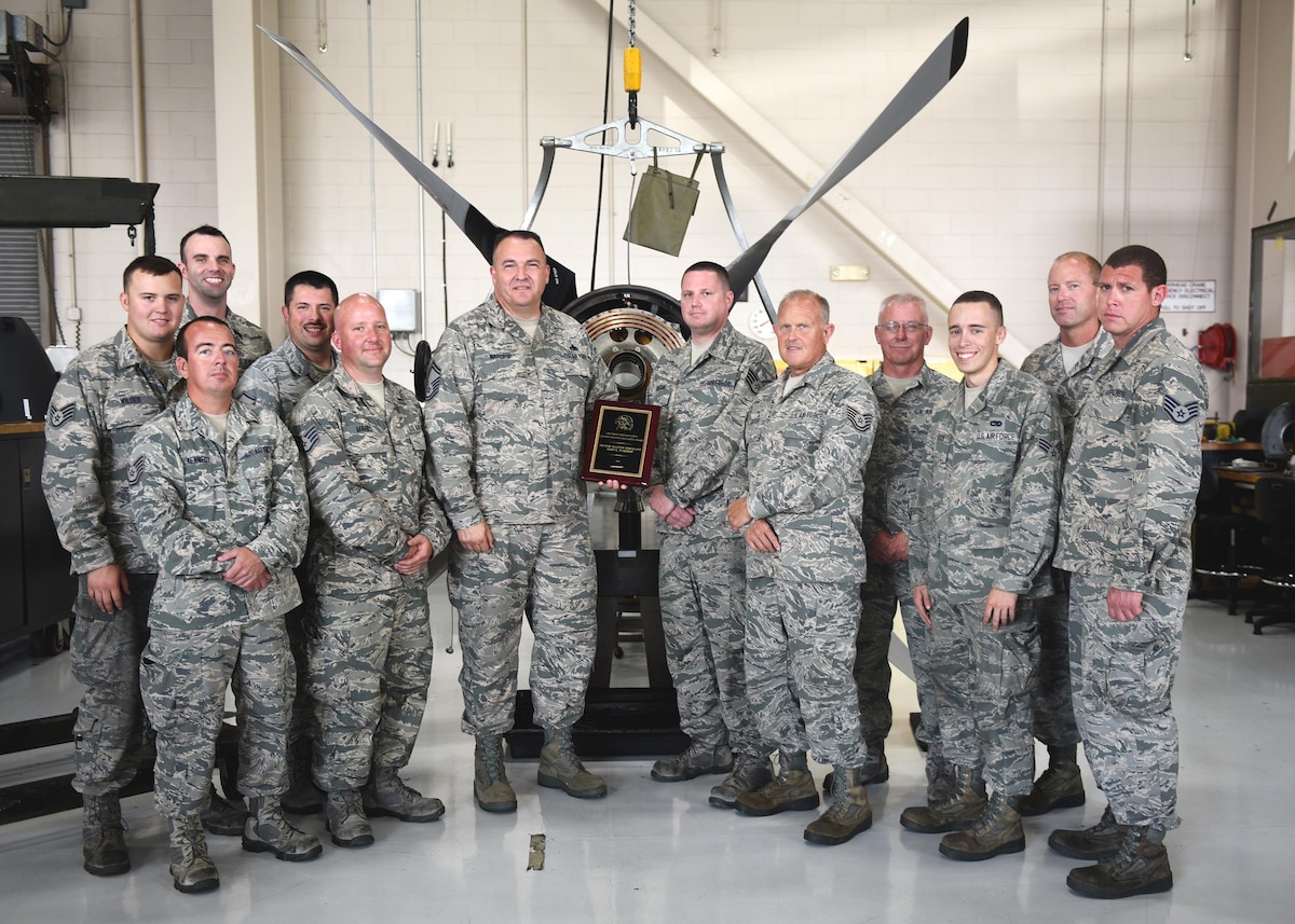 Senior Master Sgt. John Wardrip (center left), propulsion element supervisor with the Kentucky Air National Guard's 123rd Maintenance Squadron, received the Air Force Chief of Safety Aviation Maintenance Safety Award for 2016. Standing with him are Airmen from the propulsion element, whom Wardrip credited with making the award possible through their expertise and dedication. (U.S. Air National Guard photo by Tech. Sgt. Vicky Spesard)