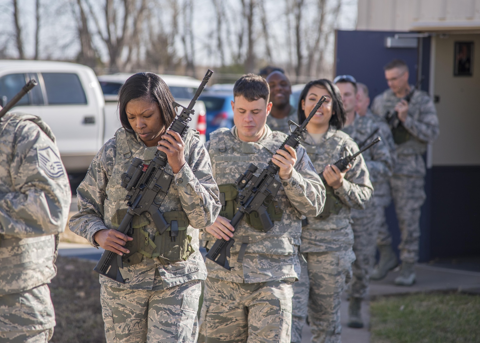 Citizen Airmen with the 931st Air Refueling Wing safely carry M-4 carbines at port arms during a combat arms training and maintenance course Dec. 2, 2017, at McConnell Air Force Base, Kan.