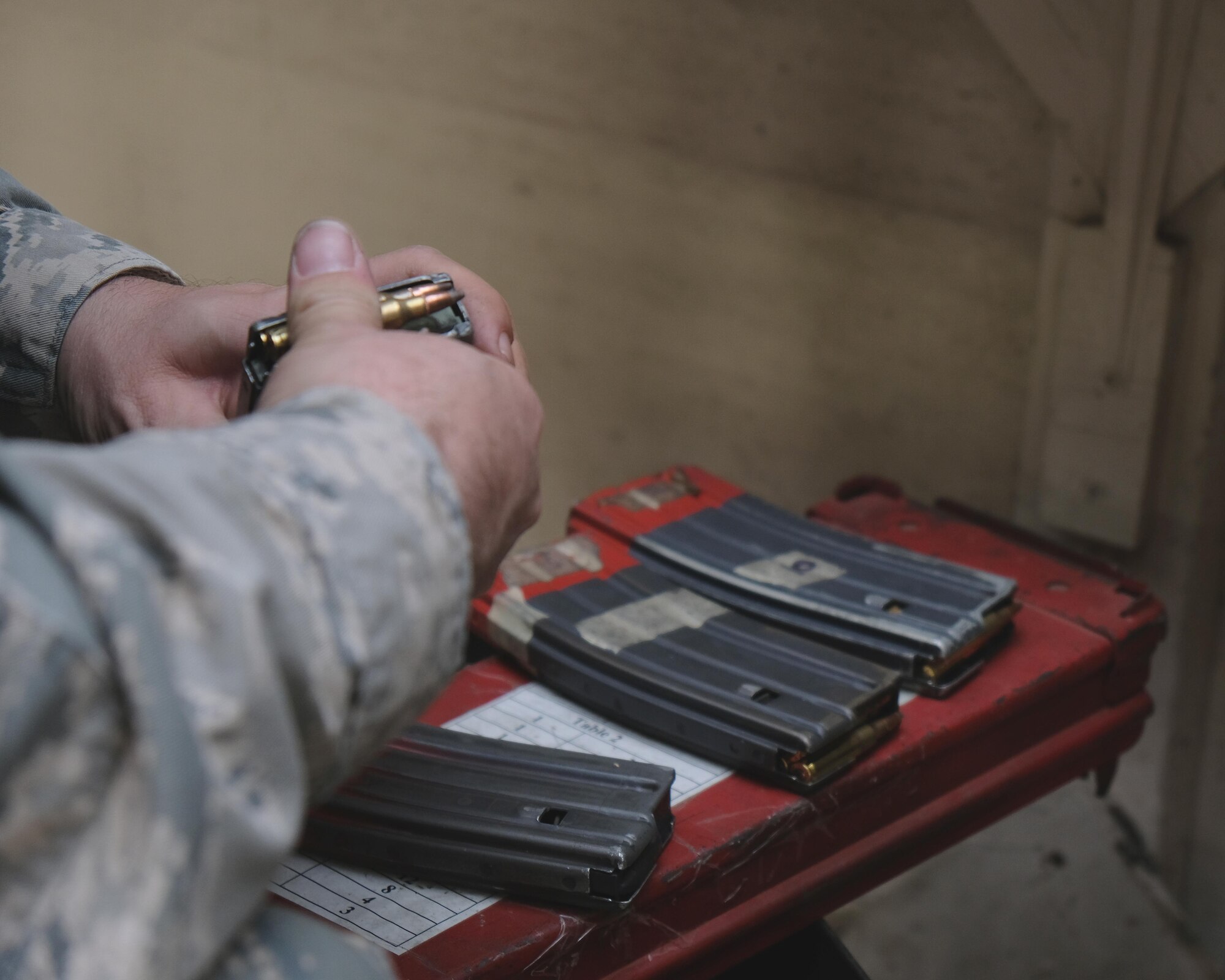 A Citizen Airman with the 931st Air Refueling Wing loads rounds into a magazine during a combat arms training and maintenance course Dec. 2, 2017, at McConnell Air Force Base, Kan.