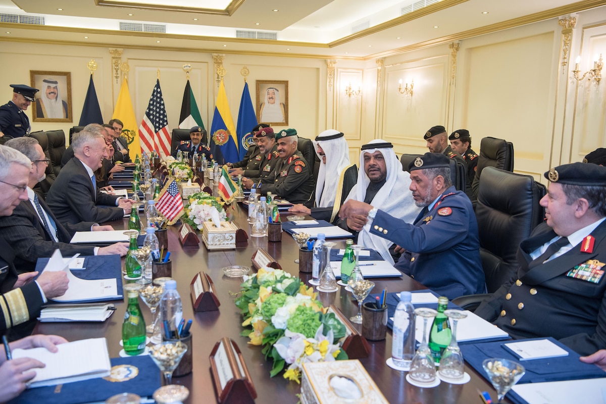 Defense Secretary James N. Mattis sits at a table for a meeting with Kuwaiti leaders.