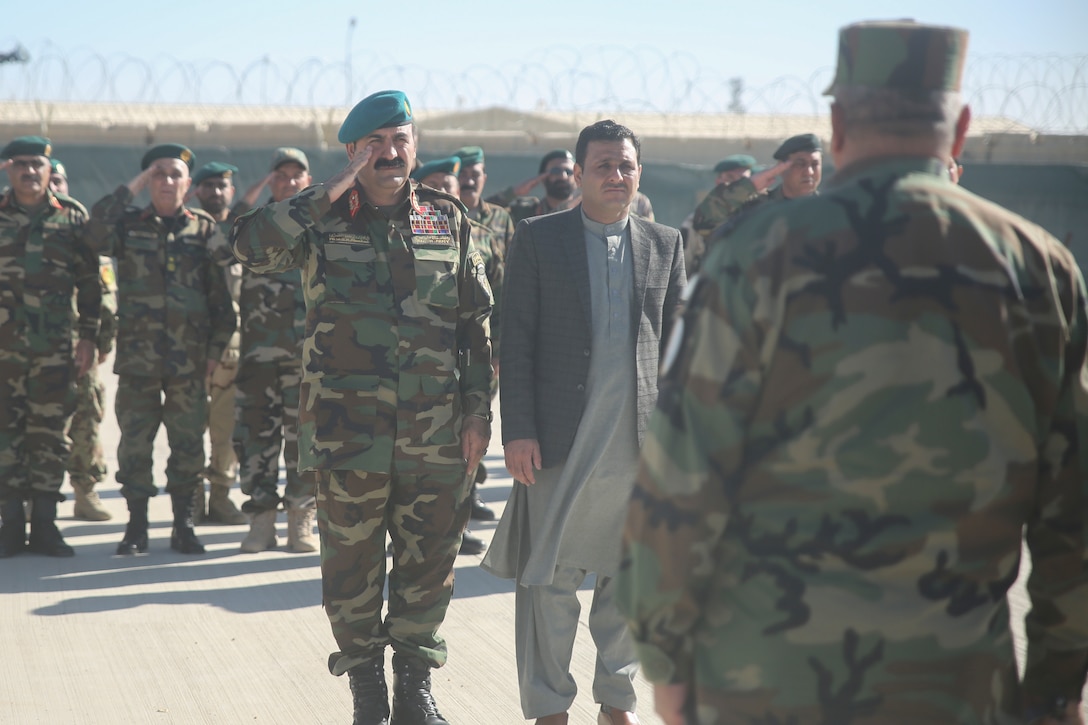 Afghan National Army Maj. Gen. Wali Mohammed Ahmadzai, center-left, the commanding general of 215th Corps, and Sardar Mohammed Hamdard, center-right, the first deputy governor of Helmand province, greet ANA Col. Shawali Zazai, right, the commanding officer of the Helmand Regional Military Training Center, during a graduation ceremony at Camp Shorabak, Afghanistan, Dec. 3, 2017. Approximately 350 soldiers with 6th Kandak, 1st Brigade, 215th Corps completed an operational readiness cycle at the RMTC, developing their infantry capabilities to combat the Taliban throughout the region. (U.S. Marine Corps photo by Sgt. Lucas Hopkins)