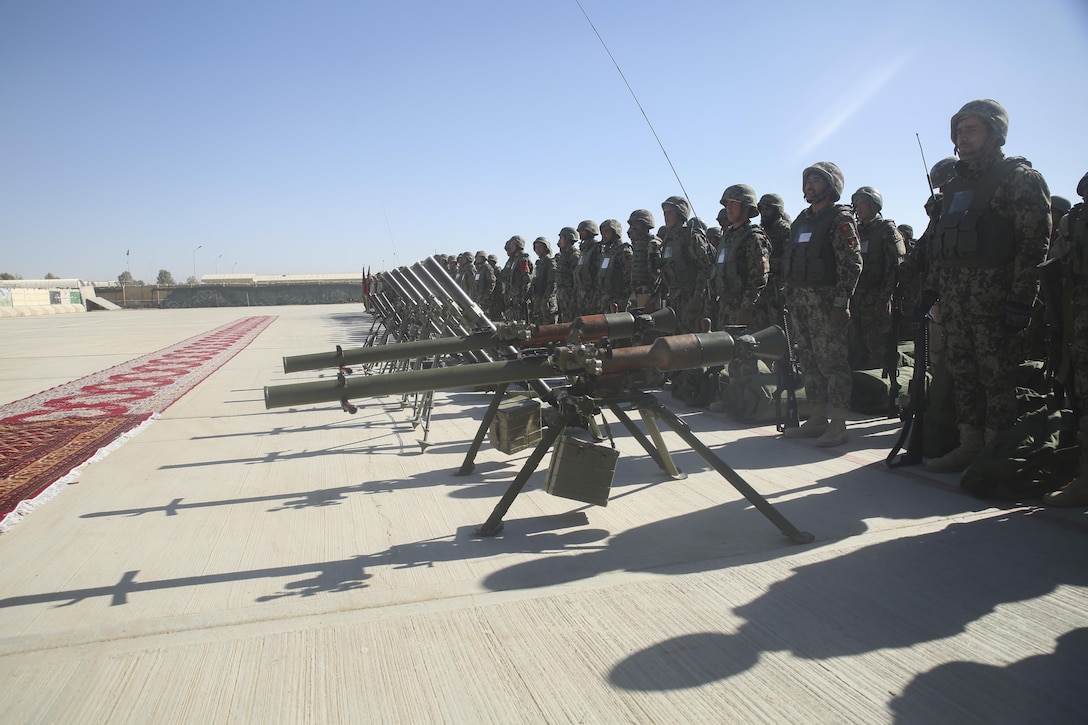 Afghan National Army soldiers with 6th Kandak, 1st Brigade, 215th Corps recite the ANA battle song during a graduation ceremony at Camp Shorabak, Afghanistan, Dec. 3, 2017. The event concluded an eight-week operational readiness cycle, which was led by Afghan instructors at the Helmand Regional Military Training Center. Hundreds of soldiers with 6th Kandak, 1st Brigade developed their individual and collective infantry skills throughout the course in preparation for combat operations against the Taliban in Helmand province. (U.S. Marine Corps photo by Sgt. Lucas Hopkins)