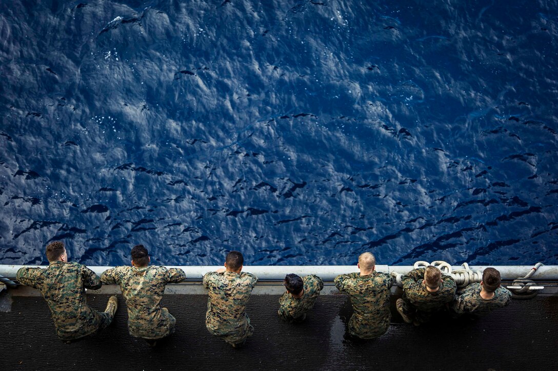 U.S. Marines with Fox Company, Battalion Landing Team, 2nd Battalion, 6th Marine Regiment, 26th Marine Expeditionary Unit, wait for a meritorious promotion ceremony to commence aboard the dock landing ship USS Oak Hill in the Atlantic Ocean, Dec. 2, 2017, during Combined Composite Traiing Unit Exercise. Combined COMPTUEX allows all elements of the Marine Air Ground Task Force to join and train in realistic scenarios so the MEU as a whole can meet its Predeployment Training Program objectives prior to an upcoming deployment at sea.